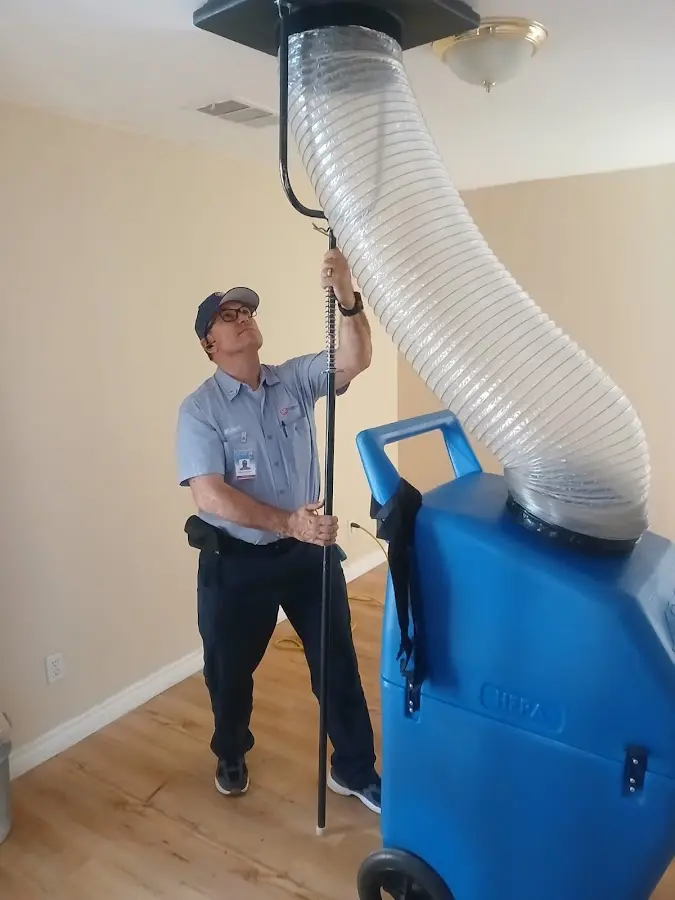Furnace Tune-Up technician using HEPA equipment in Park City